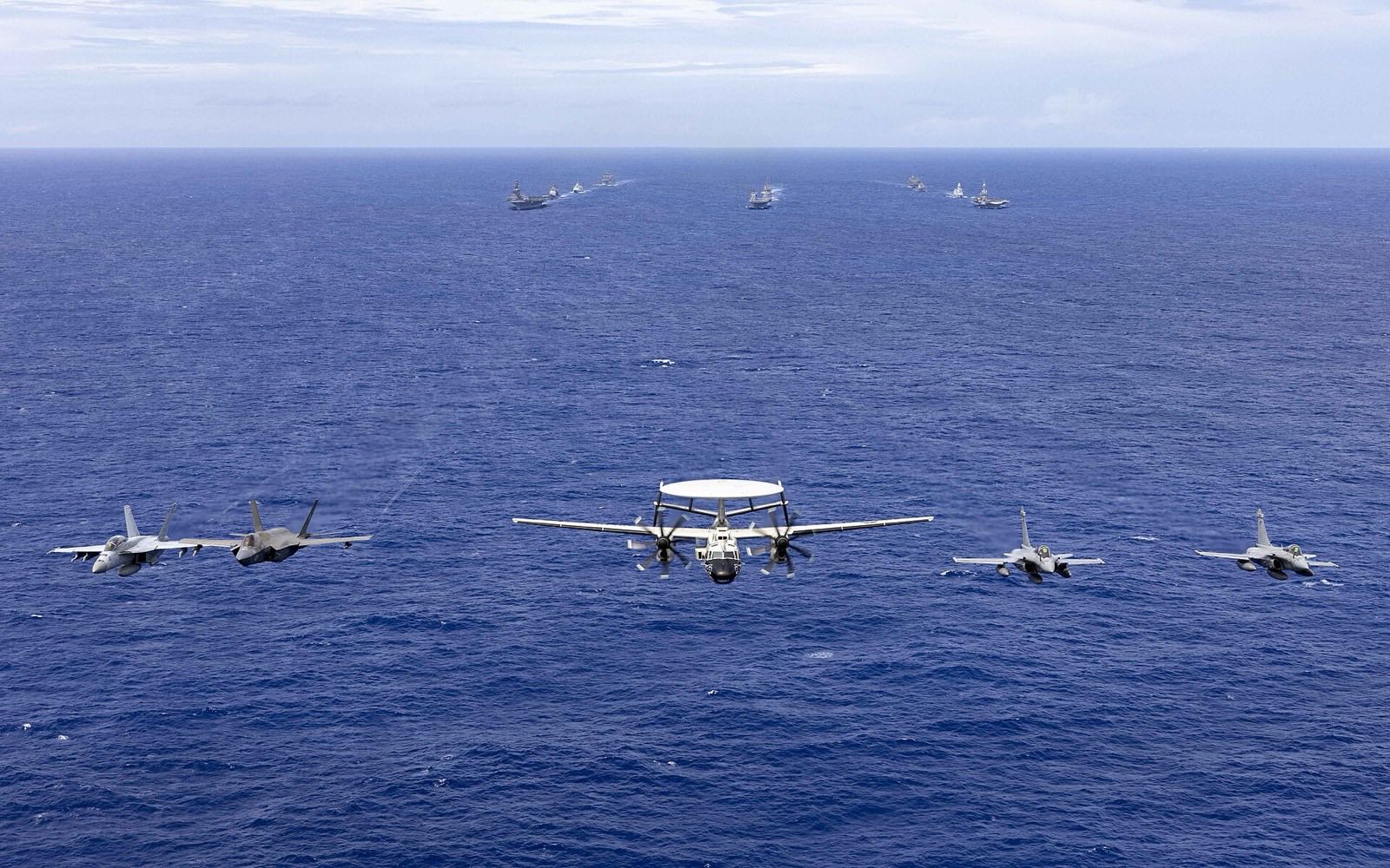 Carrier strike group sailing in formation
